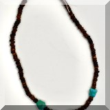 J164. Stacked bead necklace with three turquoise stones. - $24 